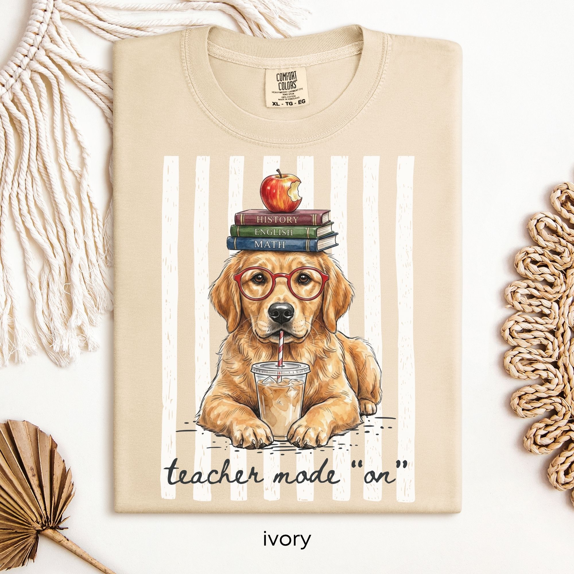Tshirt design: Golden retriever sipping iced coffee with books and apple balanced on his head.